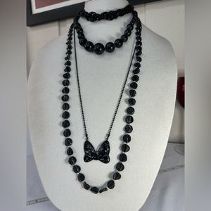 Four interesting black statement necklaces